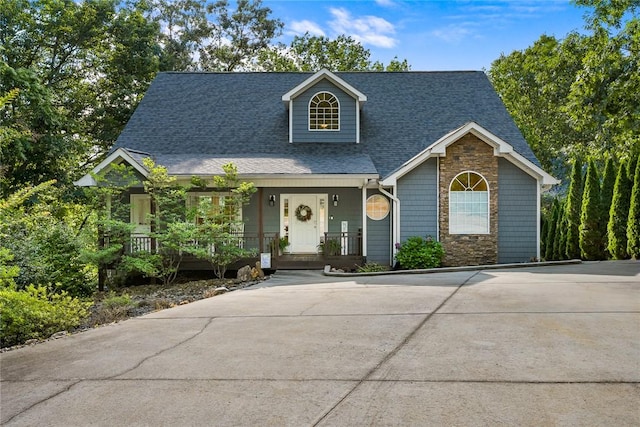 223 Inlet Pointe Dr, Anderson, SC 29625 - view of front facade featuring covered porch, stone siding, a shingled roof, and concrete driveway