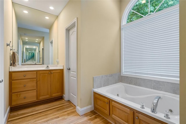 223 Inlet Pointe Dr, Anderson, SC 29625 - full bathroom featuring vanity, a jetted tub, wood finished floors, and recessed lighting