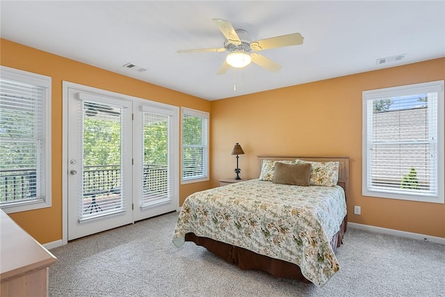 223 Inlet Pointe Dr, Anderson, SC 29625 - carpeted bedroom featuring access to outside, multiple windows, and a ceiling fan