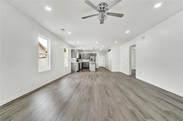1938 Inman Dr, Anderson, SC 29625 - unfurnished living room with a ceiling fan, recessed lighting, and wood finished floors