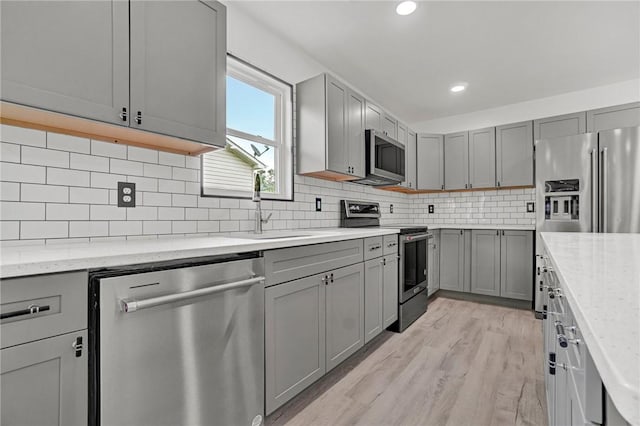 1938 Inman Dr, Anderson, SC 29625 - kitchen with appliances with stainless steel finishes, gray cabinetry, light wood-style floors, and recessed lighting