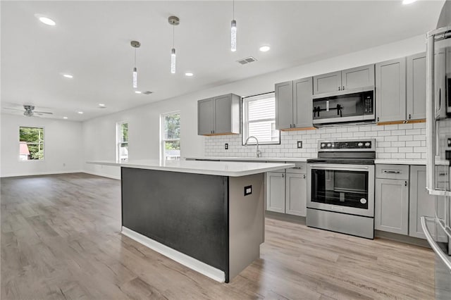 1938 Inman Dr, Anderson, SC 29625 - kitchen featuring appliances with stainless steel finishes, gray cabinets, tasteful backsplash, and recessed lighting