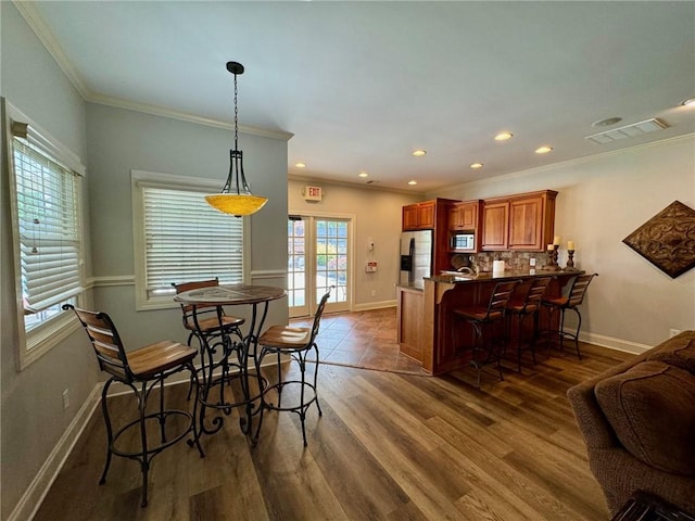 209 Calhoun St Unit 402, Clemson, SC 29631 - dining room with ornamental molding, dark wood-type flooring, and recessed lighting