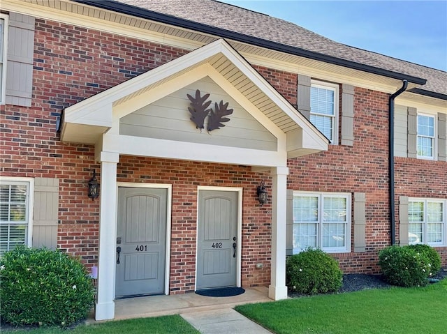 209 Calhoun St Unit 402, Clemson, SC 29631 - view of exterior entry featuring brick siding and a shingled roof