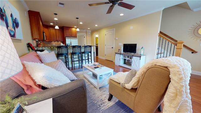 209 Calhoun St Unit 402, Clemson, SC 29631 - living area featuring recessed lighting, light wood-style floors, ceiling fan, ornamental molding, and stairway