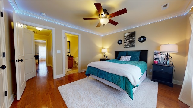 209 Calhoun St Unit 402, Clemson, SC 29631 - bedroom featuring ornamental molding, wood finished floors, and connected bathroom