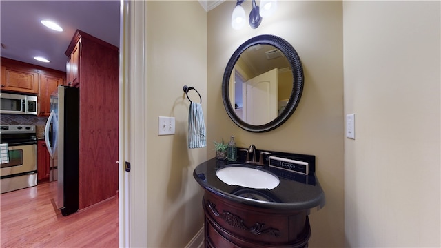 209 Calhoun St Unit 402, Clemson, SC 29631 - bathroom featuring wood finished floors, tasteful backsplash, and recessed lighting