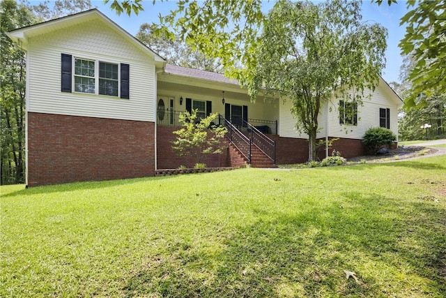 101 Jocassee Falls Rd, Salem, SC 29676 - view of front facade with a front yard, brick siding, and stairway