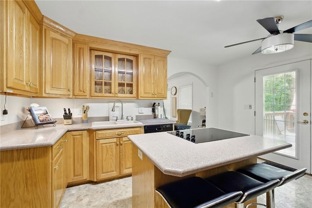 101 Jocassee Falls Rd, Salem, SC 29676 - kitchen with black appliances, arched walkways, a ceiling fan, a breakfast bar, and glass insert cabinets
