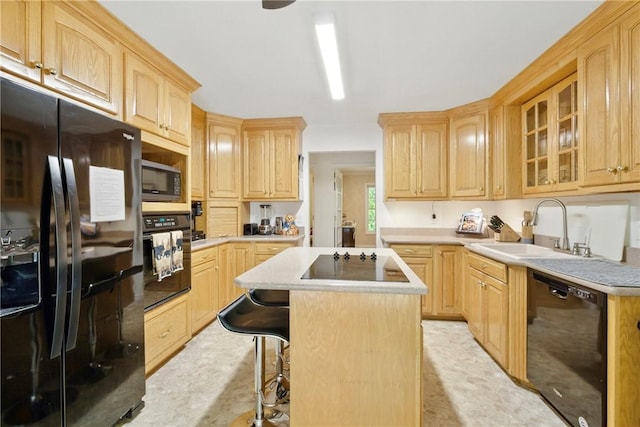 101 Jocassee Falls Rd, Salem, SC 29676 - kitchen featuring black appliances, light brown cabinets, a kitchen island, glass insert cabinets, and a kitchen breakfast bar