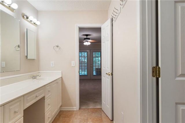 537 Sullivans Way, Seneca, SC 29678 - bathroom with french doors, vanity, tile patterned flooring, and a ceiling fan