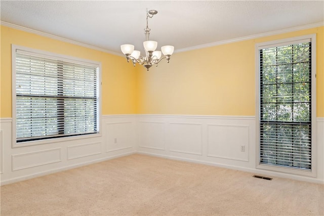 537 Sullivans Way, Seneca, SC 29678 - unfurnished room featuring a chandelier, ornamental molding, wainscoting, light carpet, and a decorative wall
