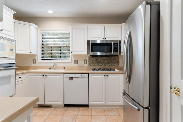 537 Sullivans Way, Seneca, SC 29678 - kitchen with appliances with stainless steel finishes, white cabinetry, light countertops, recessed lighting, and light tile patterned flooring
