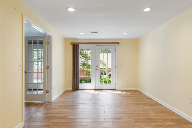 537 Sullivans Way, Seneca, SC 29678 - spare room featuring french doors, light wood-style flooring, and recessed lighting