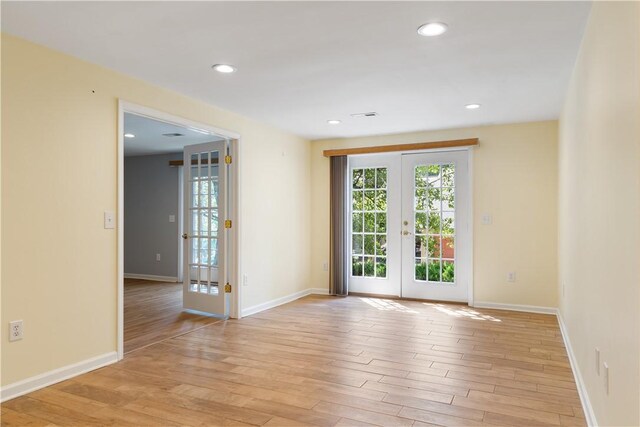 537 Sullivans Way, Seneca, SC 29678 - unfurnished room featuring french doors, plenty of natural light, light wood-type flooring, and recessed lighting