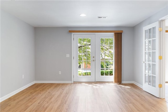 537 Sullivans Way, Seneca, SC 29678 - spare room featuring french doors and light wood-style floors