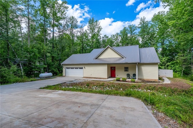 128 Willys Creek Cir, Pickens, SC 29671 - view of front of property featuring driveway, a garage, and a metal roof