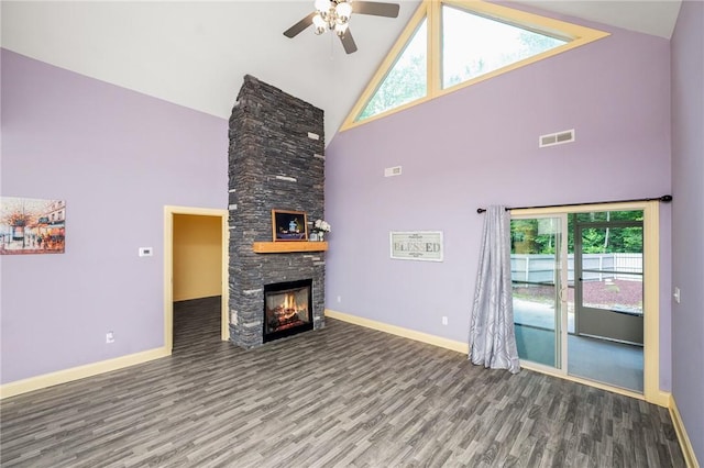 128 Willys Creek Cir, Pickens, SC 29671 - unfurnished living room with high vaulted ceiling, wood finished floors, ceiling fan, and a stone fireplace