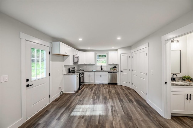 121 Brookmeade Dr Unit A & B, Anderson, SC 29624 - kitchen with appliances with stainless steel finishes, dark wood finished floors, white cabinetry, recessed lighting, and tasteful backsplash