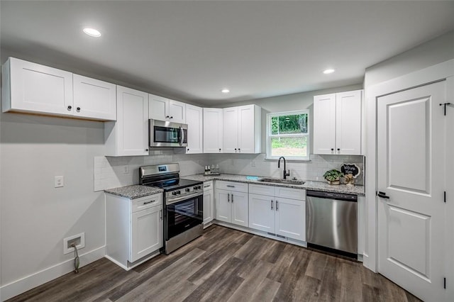 121 Brookmeade Dr Unit A & B, Anderson, SC 29624 - kitchen featuring stainless steel appliances, light stone counters, dark wood-style floors, white cabinetry, and tasteful backsplash
