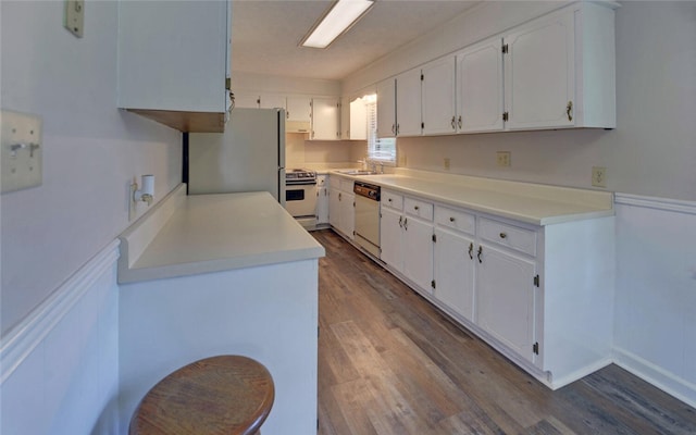 37 Cunningham Dr, Hartwell, GA 30643 - kitchen featuring white appliances, dark wood-type flooring, white cabinetry, and light countertops