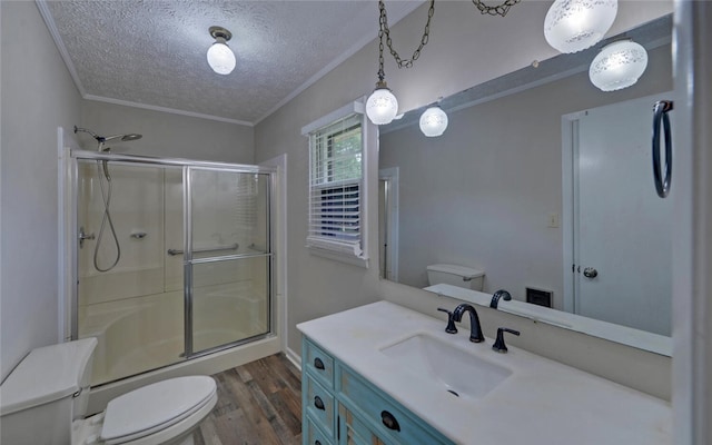 37 Cunningham Dr, Hartwell, GA 30643 - full bathroom with a textured ceiling, an enclosed shower, wood finished floors, vanity, and ornamental molding