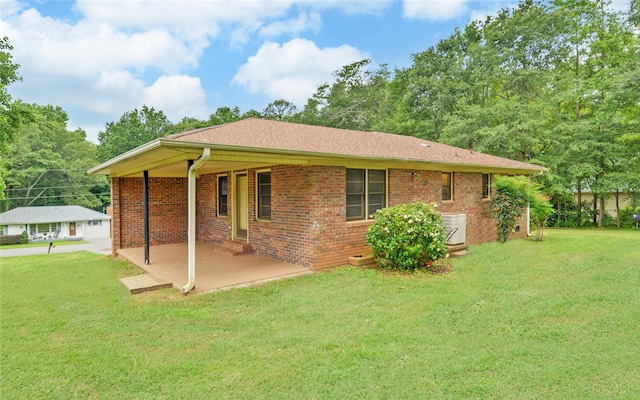 37 Cunningham Dr, Hartwell, GA 30643 - rear view of house featuring a lawn, brick siding, and a patio