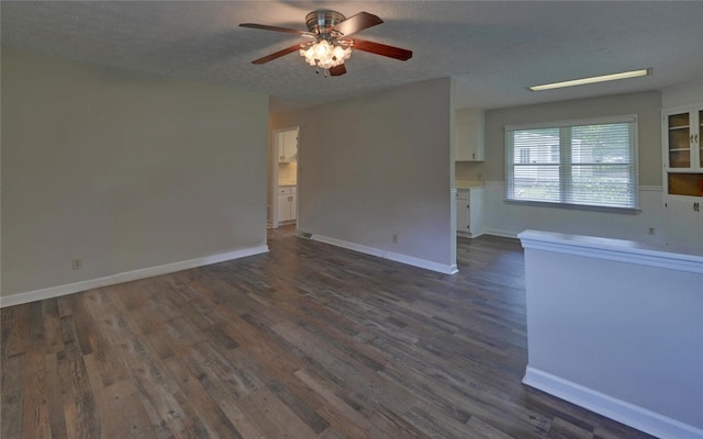 37 Cunningham Dr, Hartwell, GA 30643 - unfurnished living room with a ceiling fan, dark wood finished floors, and a textured ceiling