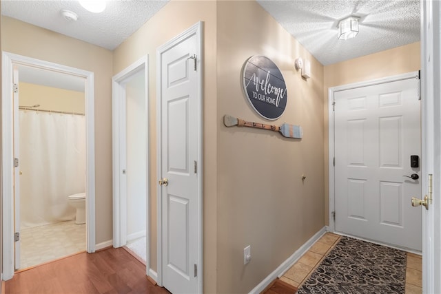 318 Weeping Willow Dr, Seneca, SC 29672 - entryway featuring a textured ceiling and baseboards