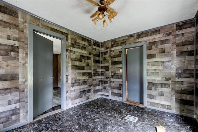 2309 Toccoa Hwy, Westminster, SC 29693 - empty room featuring a ceiling fan and wood walls