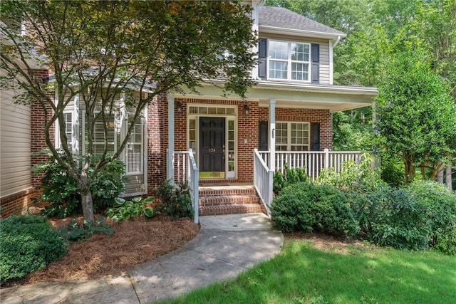 124 Bluestone Ct, Easley, SC 29642 - view of front of property featuring brick siding, covered porch, and roof with shingles