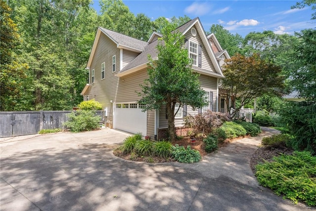 124 Bluestone Ct, Easley, SC 29642 - view of side of property with concrete driveway, a shingled roof, and an attached garage