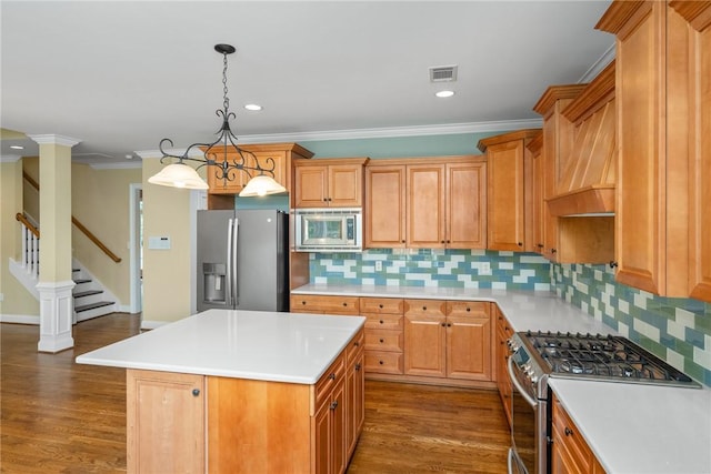 124 Bluestone Ct, Easley, SC 29642 - kitchen featuring stainless steel appliances, light countertops, decorative backsplash, dark wood-style flooring, and crown molding