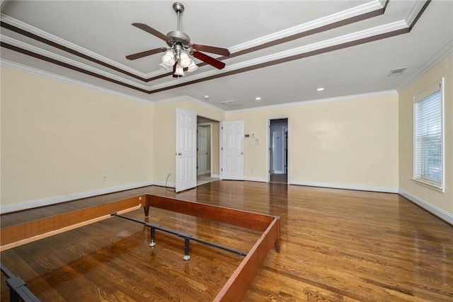 124 Bluestone Ct, Easley, SC 29642 - spare room with crown molding, wood finished floors, a ceiling fan, recessed lighting, and a tray ceiling