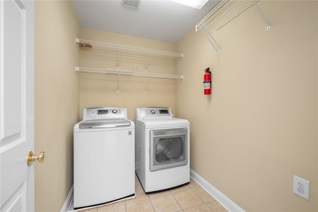 124 Bluestone Ct, Easley, SC 29642 - laundry area featuring independent washer and dryer and light tile patterned floors