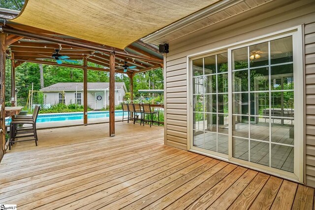 1298 Moorehead Pl, Pendleton, SC 29670 - deck featuring a ceiling fan and an outbuilding