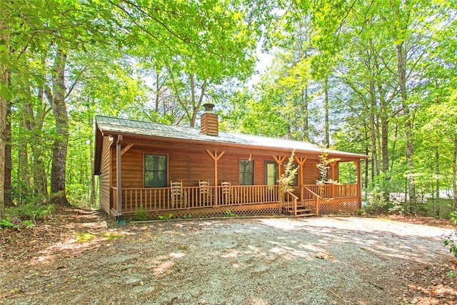 275 Lakeside Dr, Mountain Rest, SC 29664 - chalet / cabin with a porch, a chimney, and a metal roof