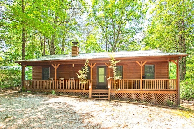 275 Lakeside Dr, Mountain Rest, SC 29664 - rustic home with a porch, a chimney, and a metal roof