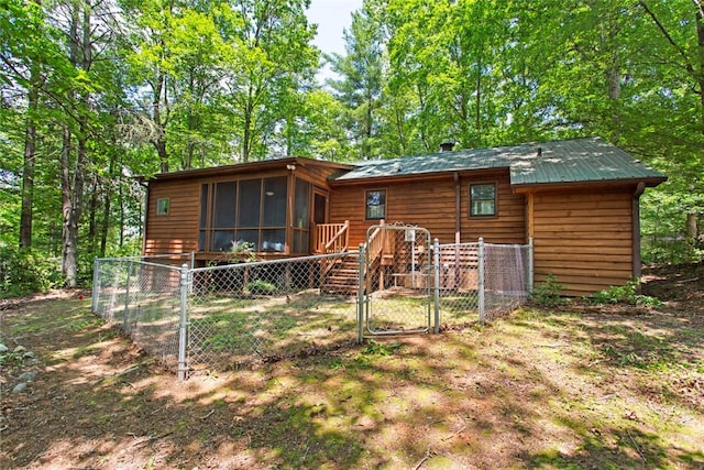 275 Lakeside Dr, Mountain Rest, SC 29664 - rear view of house featuring a gate and a sunroom