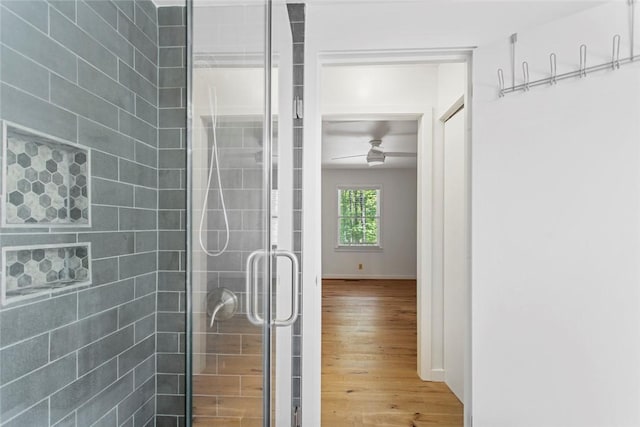 275 Lakeside Dr, Mountain Rest, SC 29664 - full bathroom featuring wood finished floors, a ceiling fan, and a stall shower