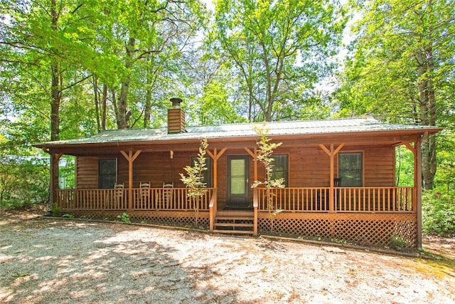275 Lakeside Dr, Mountain Rest, SC 29664 - chalet / cabin with covered porch, a chimney, and a metal roof
