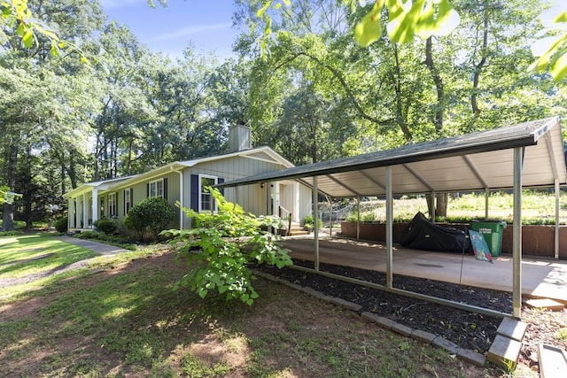 118 Nonna Ln, Seneca, SC 29678 - view of home's exterior featuring a carport and a chimney