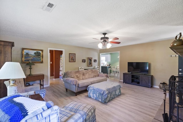 118 Nonna Ln, Seneca, SC 29678 - living area featuring ceiling fan, wood finished floors, and a textured ceiling