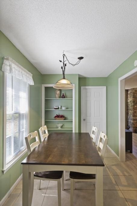 118 Nonna Ln, Seneca, SC 29678 - dining area with light tile patterned flooring and a textured ceiling
