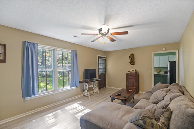 118 Nonna Ln, Seneca, SC 29678 - living room with ceiling fan, a textured ceiling, and wood finished floors