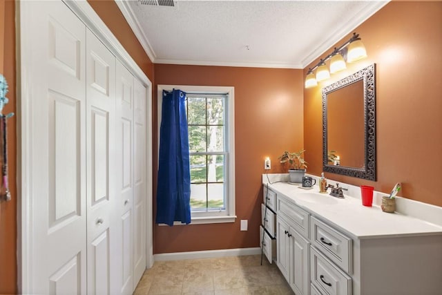 118 Nonna Ln, Seneca, SC 29678 - bathroom with vanity, ornamental molding, a textured ceiling, tile patterned flooring, and a closet