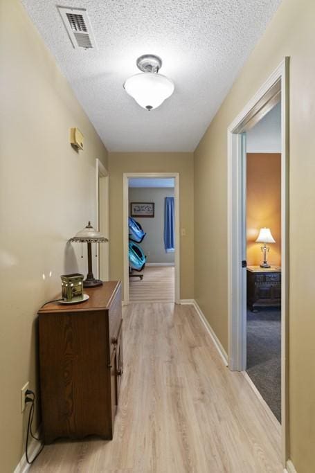 118 Nonna Ln, Seneca, SC 29678 - corridor with light wood-style floors and a textured ceiling