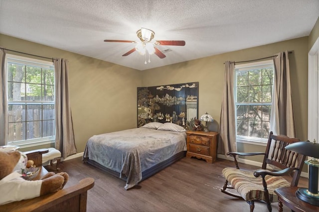 118 Nonna Ln, Seneca, SC 29678 - bedroom with dark wood-style floors, a textured ceiling, and a ceiling fan