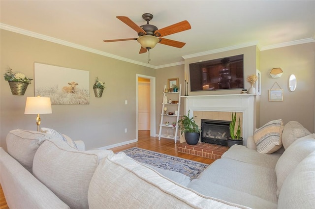 412 Singleton Rd, Anderson, SC 29625 - living area featuring wood finished floors, crown molding, ceiling fan, and a brick fireplace