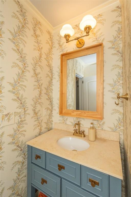 412 Singleton Rd, Anderson, SC 29625 - bathroom with wallpapered walls, vanity, and crown molding